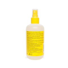Applying Mixed Chicks Kids Tangle Tamer to damp curls