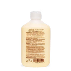 Mixed Chicks leave-in pump close-up shows easy distribution for smooth, frizz-free curls.