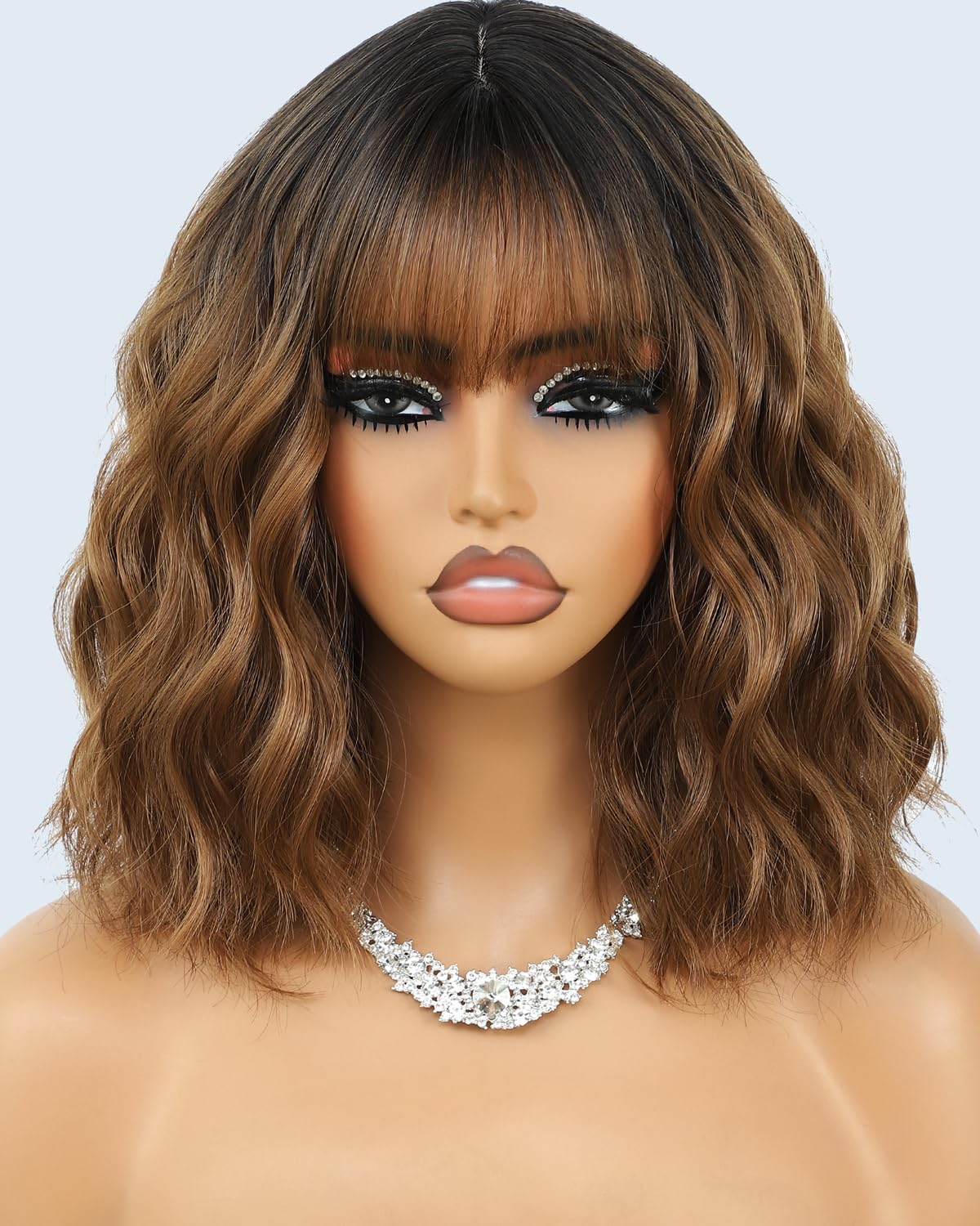 Monaluxe short bob wig with bangs in ombre blonde front view for natural everyday wear.