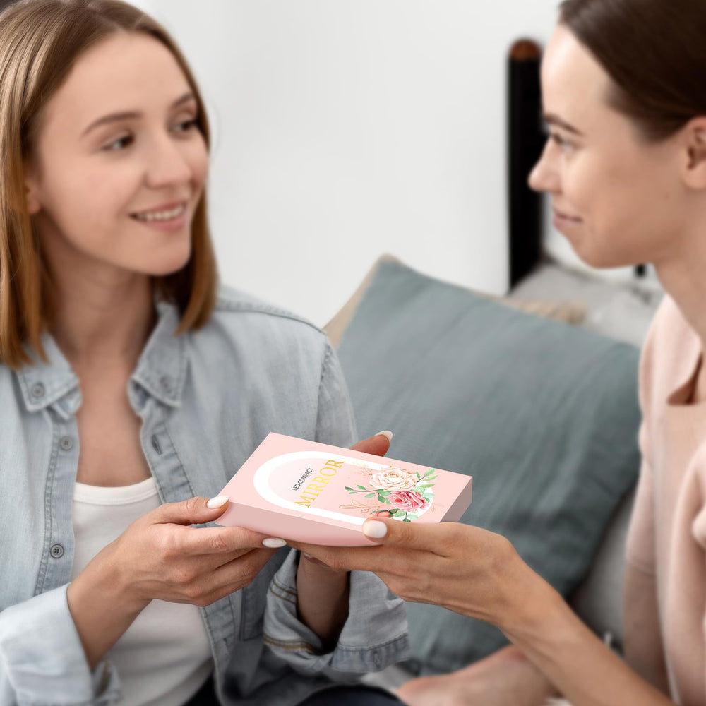 Mopis pink travel mirror fits neatly into a clutch or small bag