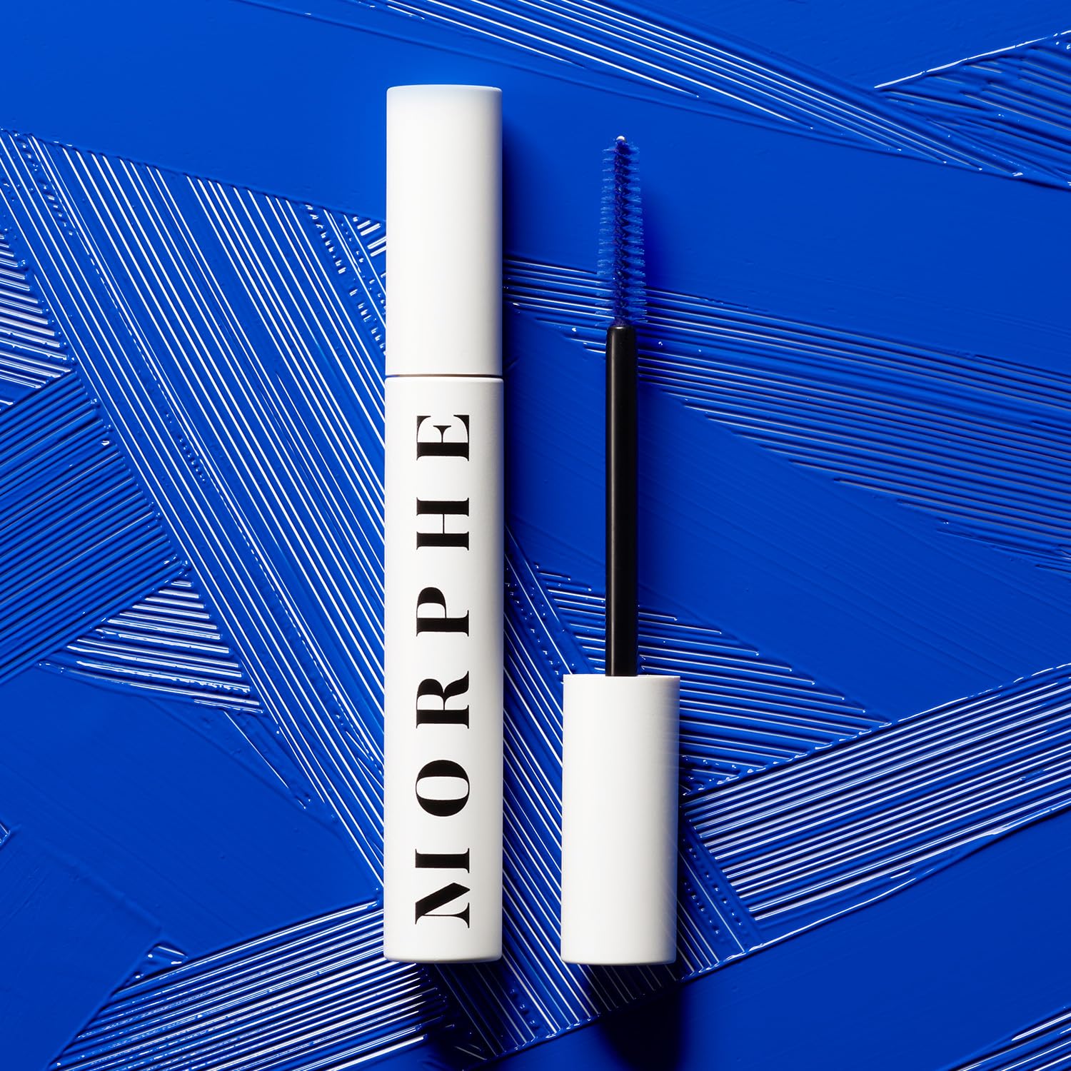 Morphe Big Prime Lash Primer before mascara highlights blue tint and enhanced color payoff.