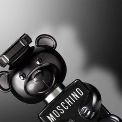 Moschino Toy Boy base notes image—vetiver and sandalwood for lasting depth.