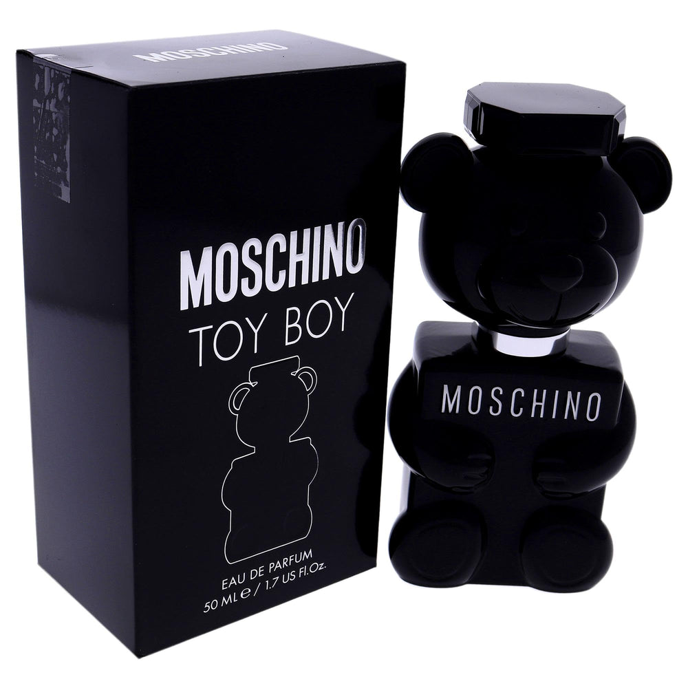 Toy Boy bottle on black background suggests versatile modern scent.