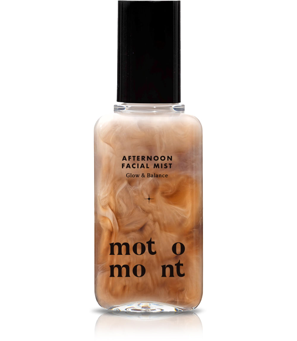 Motomont Milk Tea Dewy Skin Mist bottle close-up showing a hydrating finish.