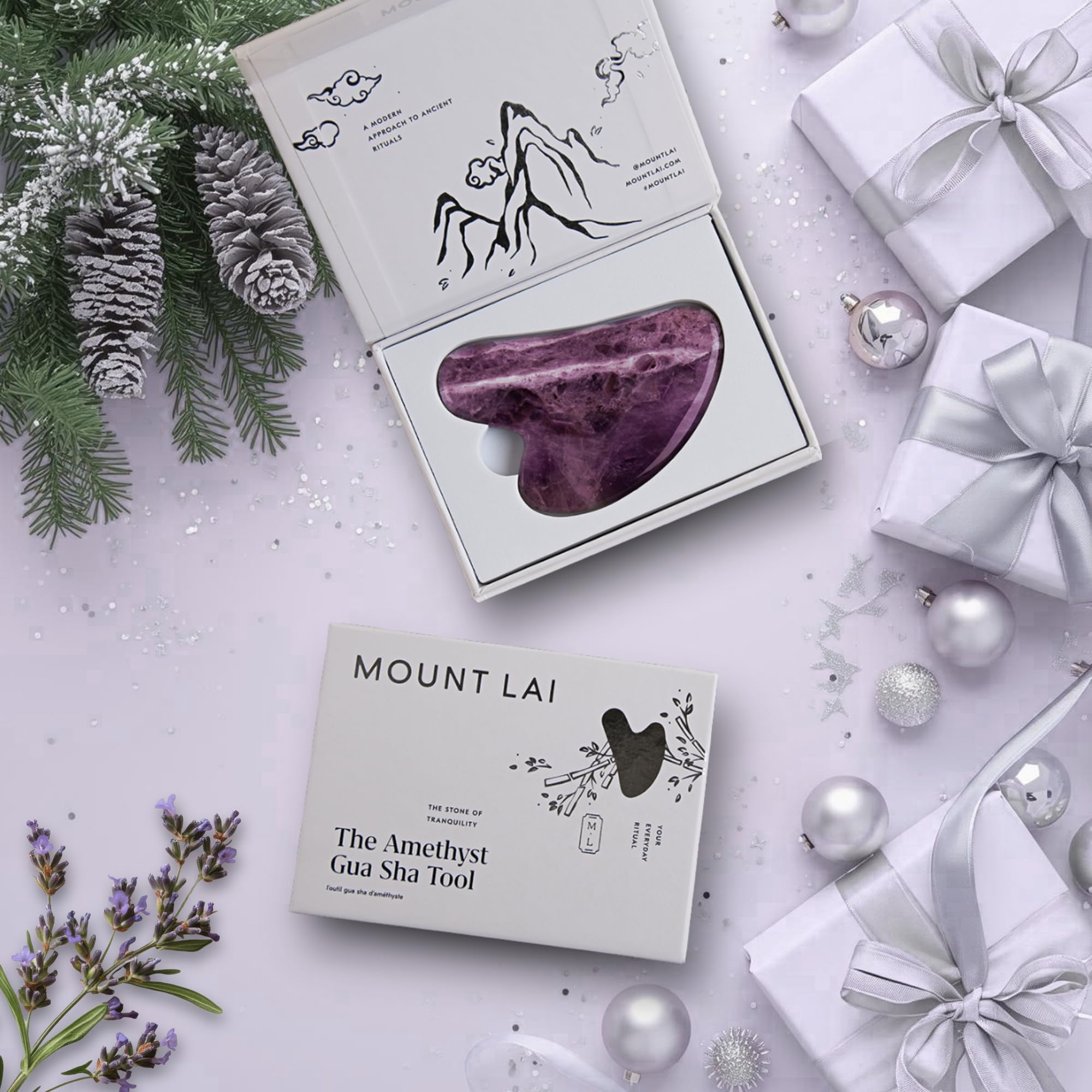 Mount Lai Amethyst Gua Sha on cheeks promoting gentle contouring and refreshed skin