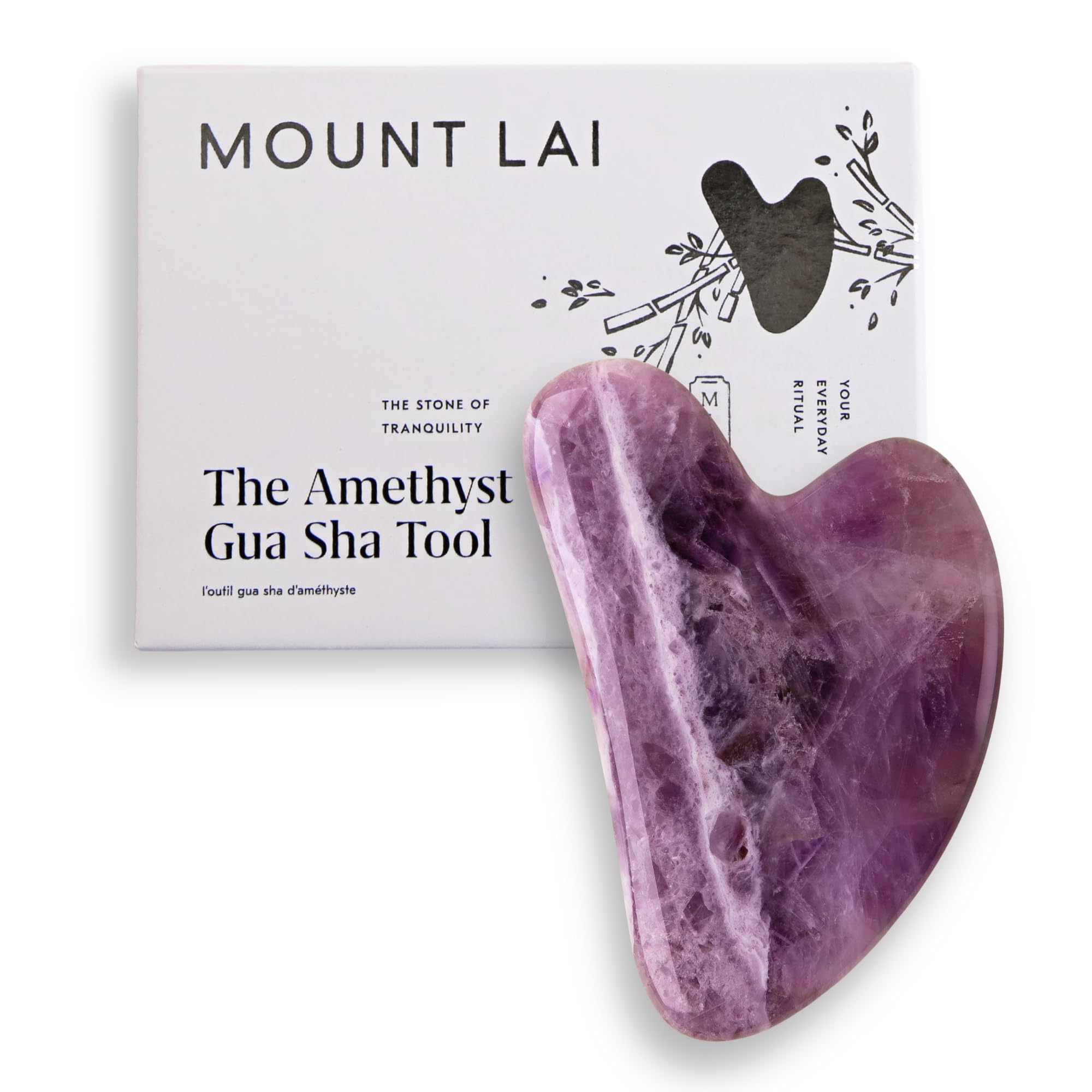Mount Lai Amethyst Gua Sha on forehead for soothing facial massage and calm clarity