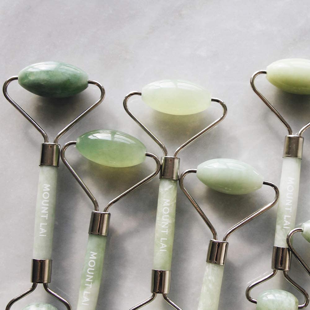 Mount Lai handcrafted jade roller in hand for easy self-care ritual