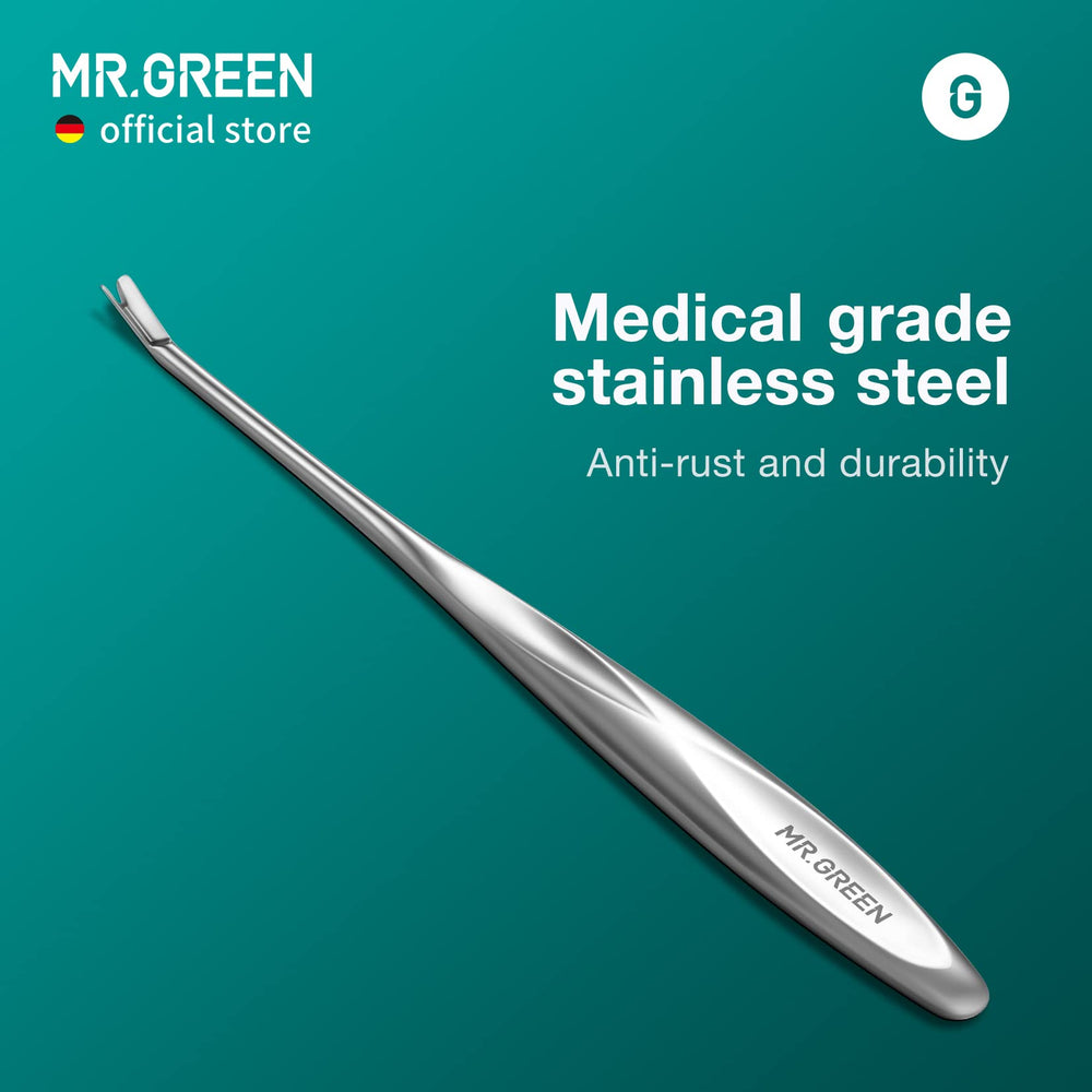 MR.GREEN Cuticle Pusher in hand during at home manicure session.