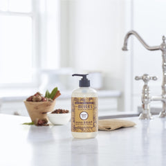Creamy foaming texture shown on hands for gentle cleansing with Acorn Spice