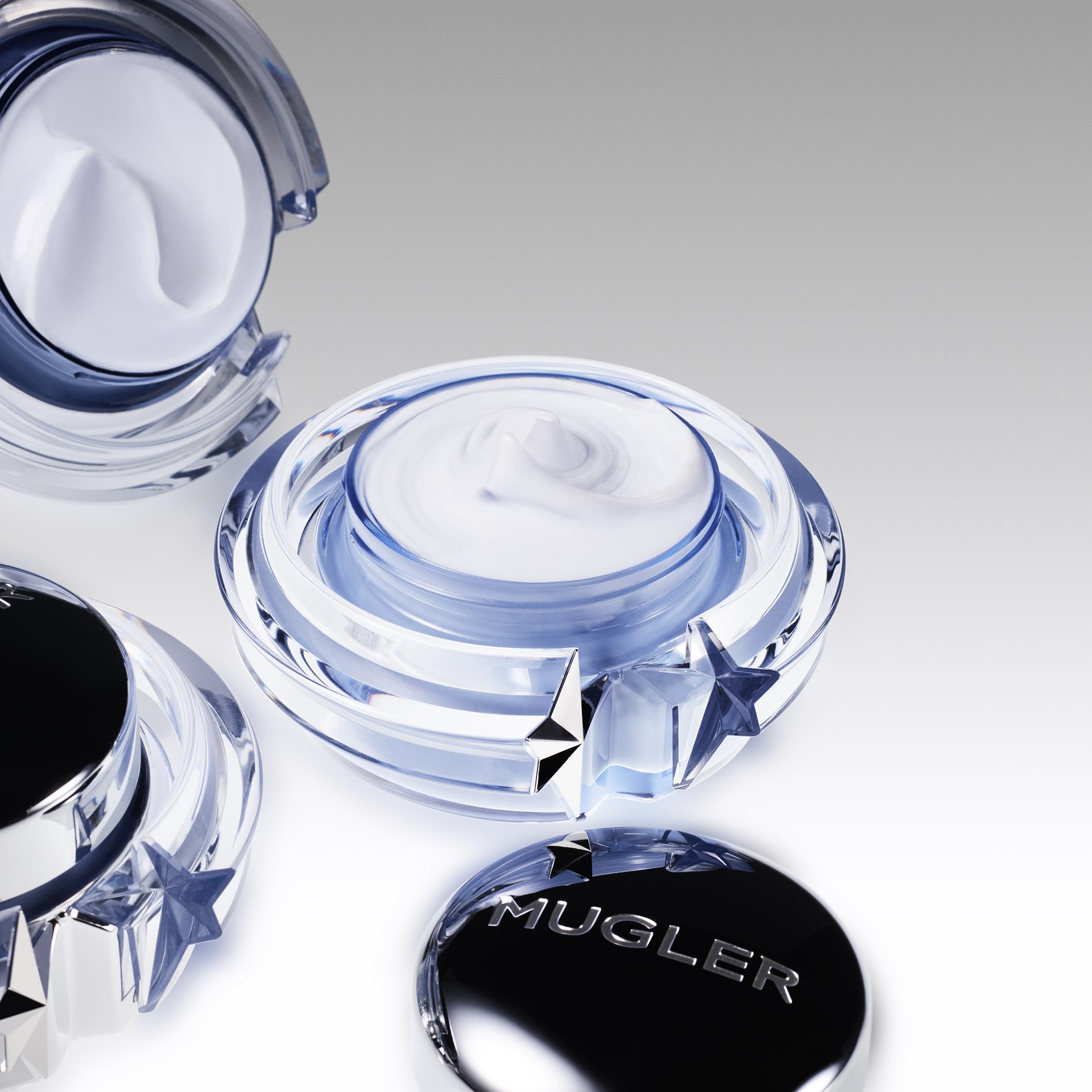 Mugler Angel Body Cream application shot suggests soothing ritual.