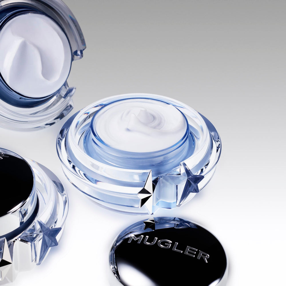 Mugler Angel Body Cream application shot suggests soothing ritual.