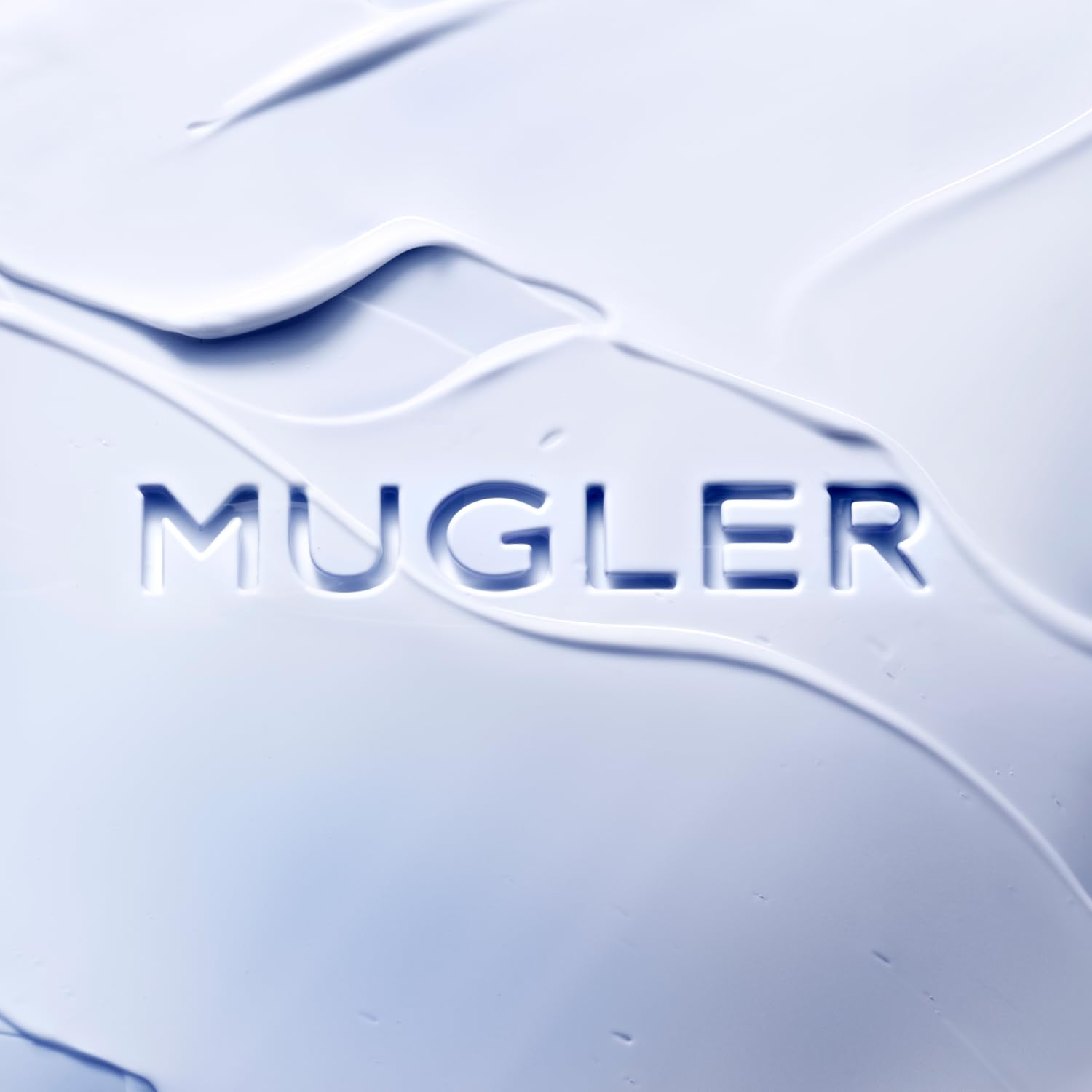 Mugler Angel Body Lotion creamy texture demonstrates lasting moisture on skin.