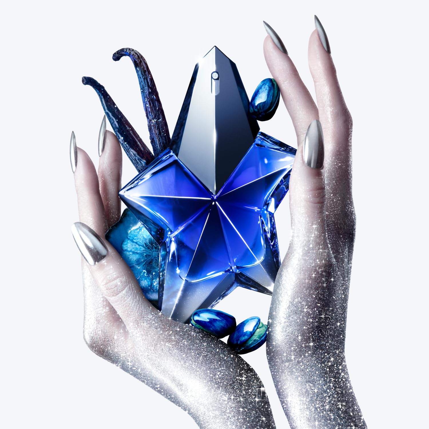 Mugler Angel Stellar woody-base-note bottle emphasizes lasting depth for confident nights.