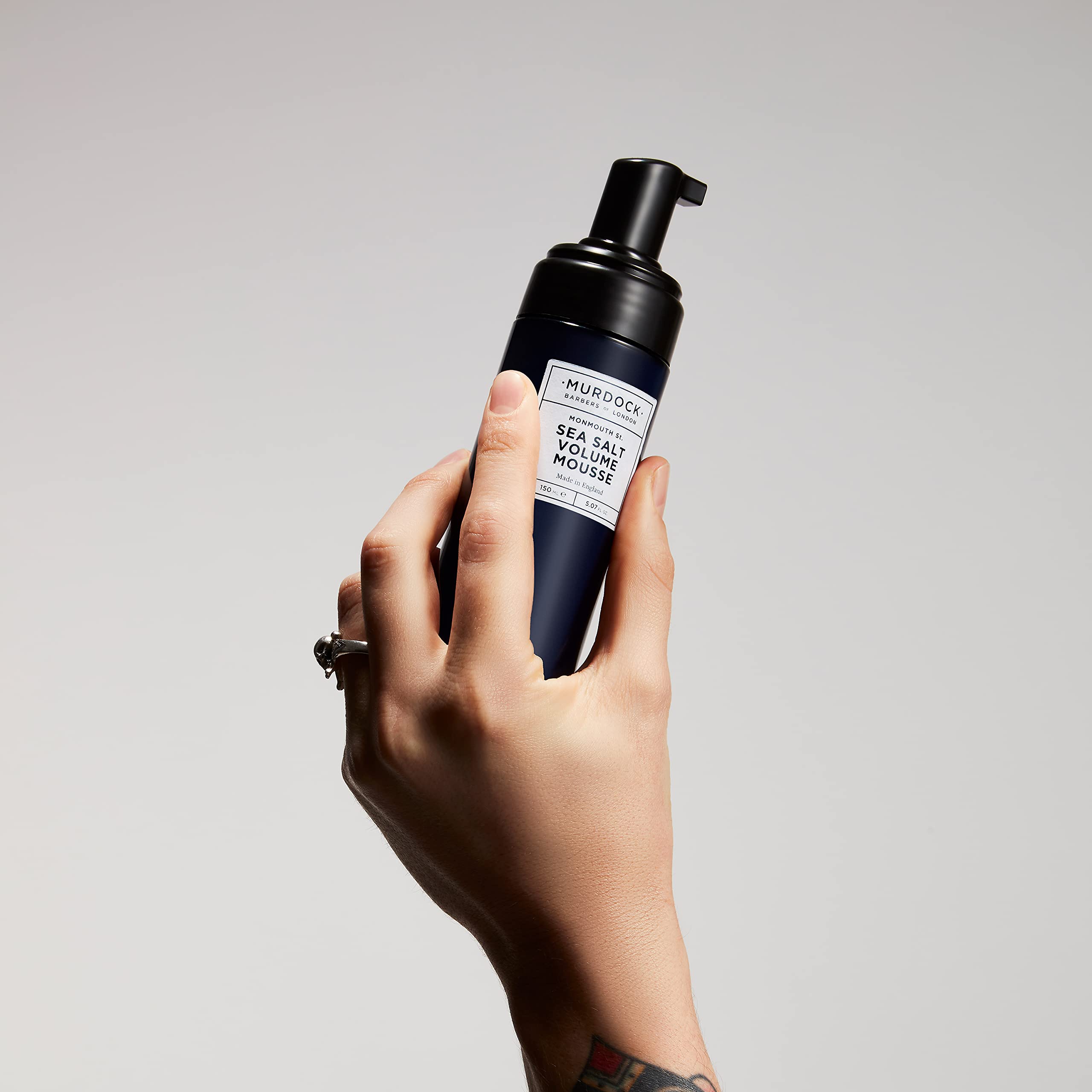 Close-up of mousse texture indicating lightweight volume and styling versatility.