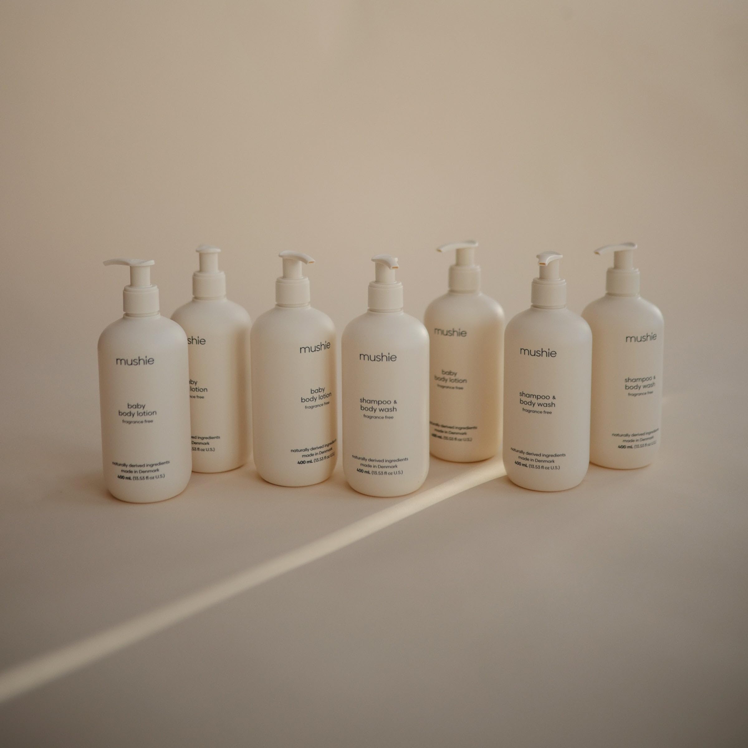 Mushie shampoo pour bottle illustrates easy distribution during bath time.
