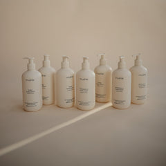 Mushie shampoo pour bottle illustrates easy distribution during bath time.