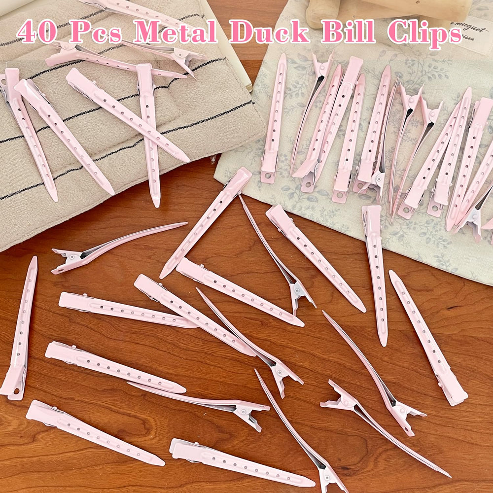 Mythos pink duck-bill clip packaging shows gift-ready set.