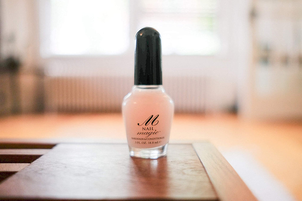 Nail Magic bottle being shaken to activate hardening formula