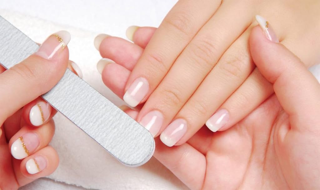 Nailtiques Formula 2 application two coats on nails demonstrates base coat versatility.
