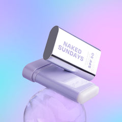 Naked Sundays SPF 50 Clear Glow Sun Stick applied to the cheek for invisible protection.