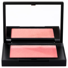 NARS Orgasm peachy-pink shimmer swatch on skin for radiant cheeks.