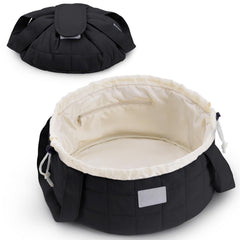 Narwey quilted drawstring makeup bag in black patent, closed for secure travel organization.