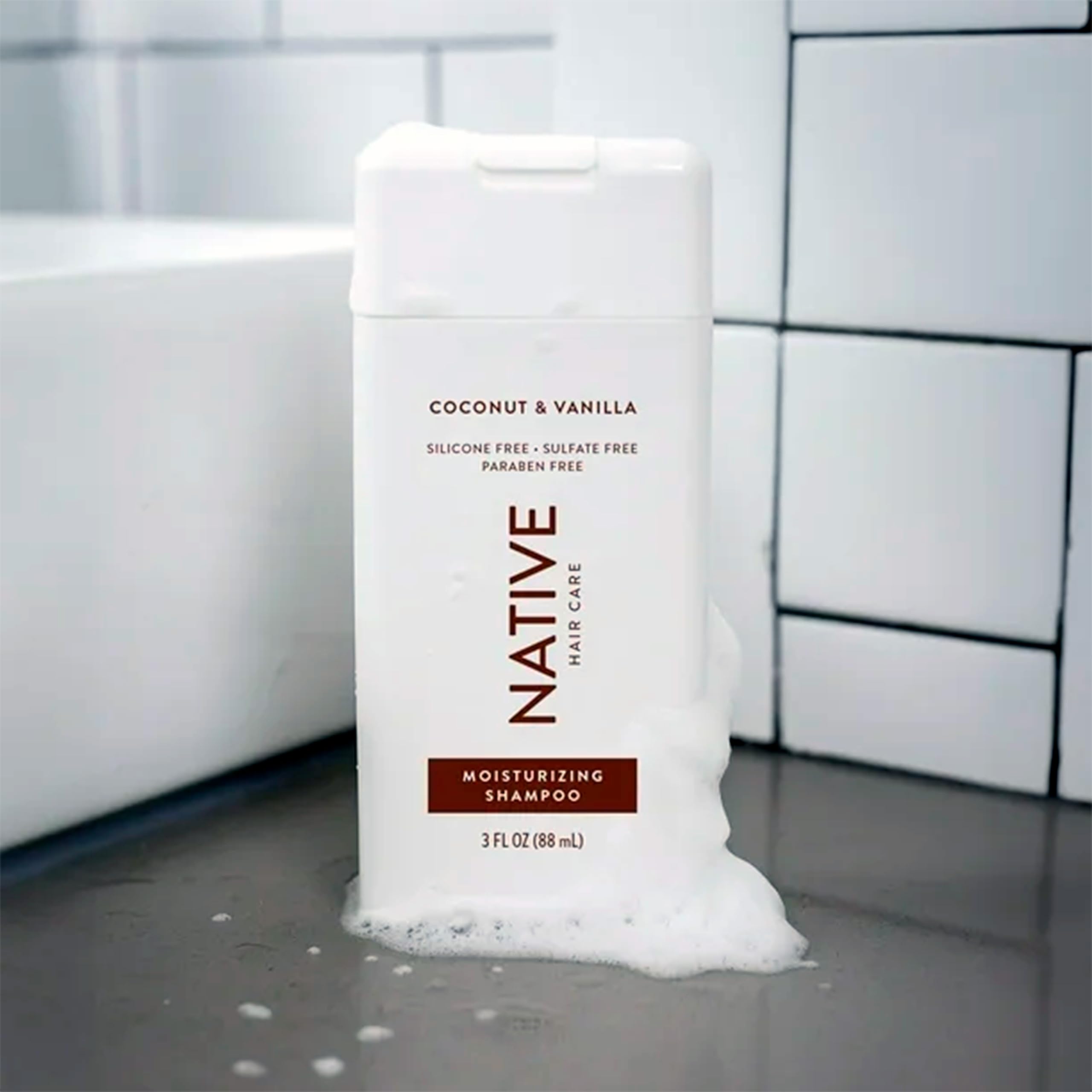 Native Coconut & Vanilla Mini shampoo foam on hair for radiant softness