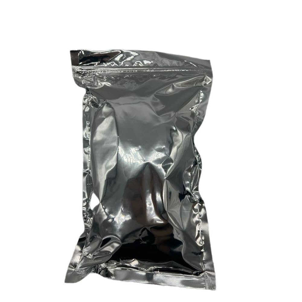 Natural Farms shea butter block in hand for skin moisturizing.