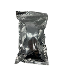 Natural Farms shea butter block in hand for skin moisturizing.