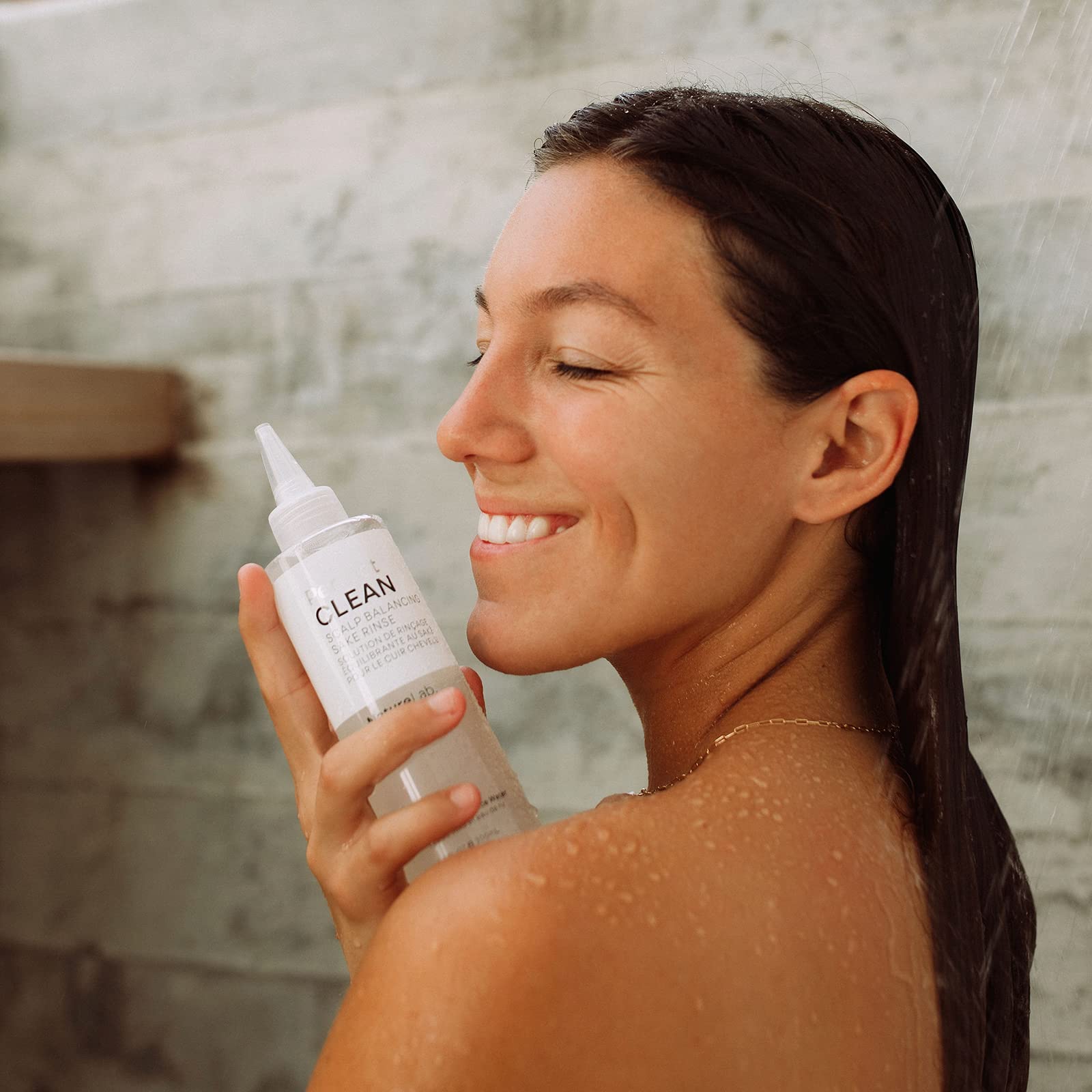 NatureLab.TOKYO Perfect Clean Sake Rinse bottle-closeup emphasizes vegan formula.