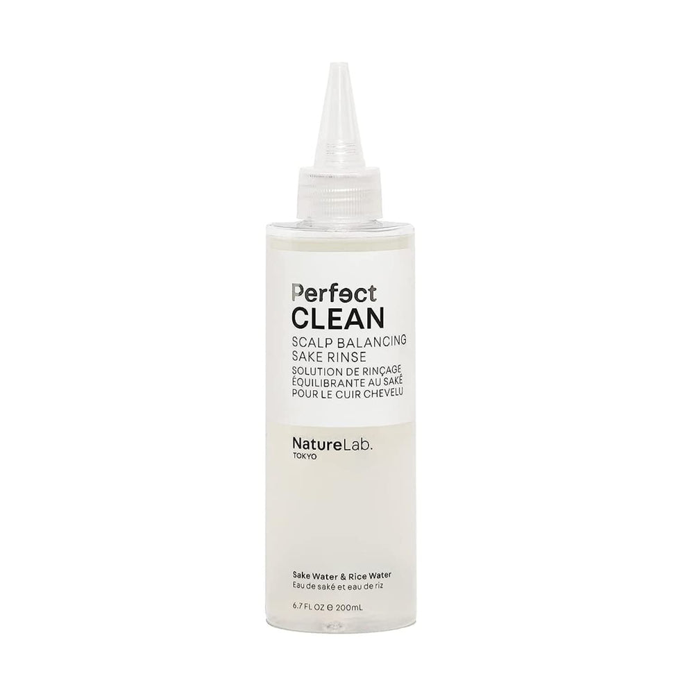 NatureLab.TOKYO Perfect Clean Sake Rinse bottle on a bathroom shelf for balanced scalp hydration.