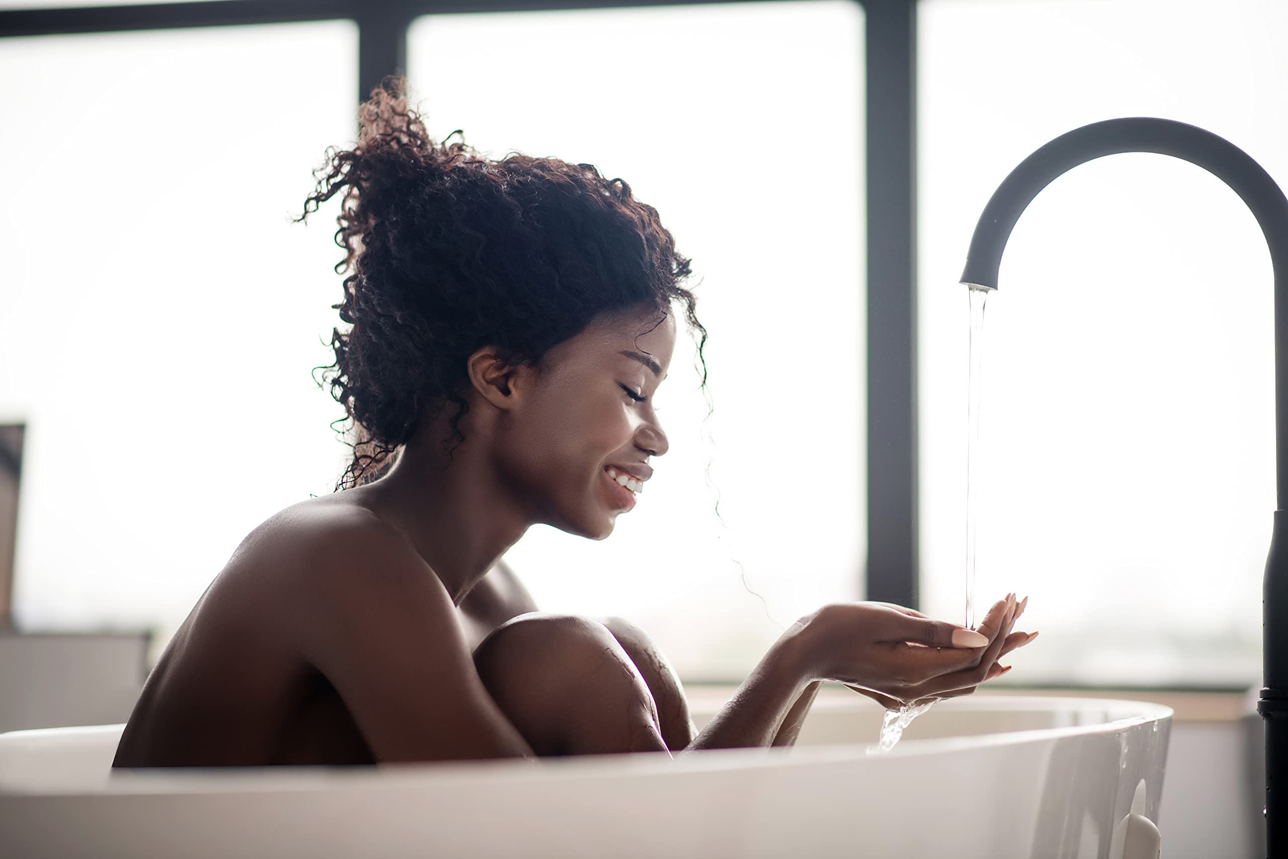 Nature's Beauty bath bomb fizzing in water with gentle bubbles