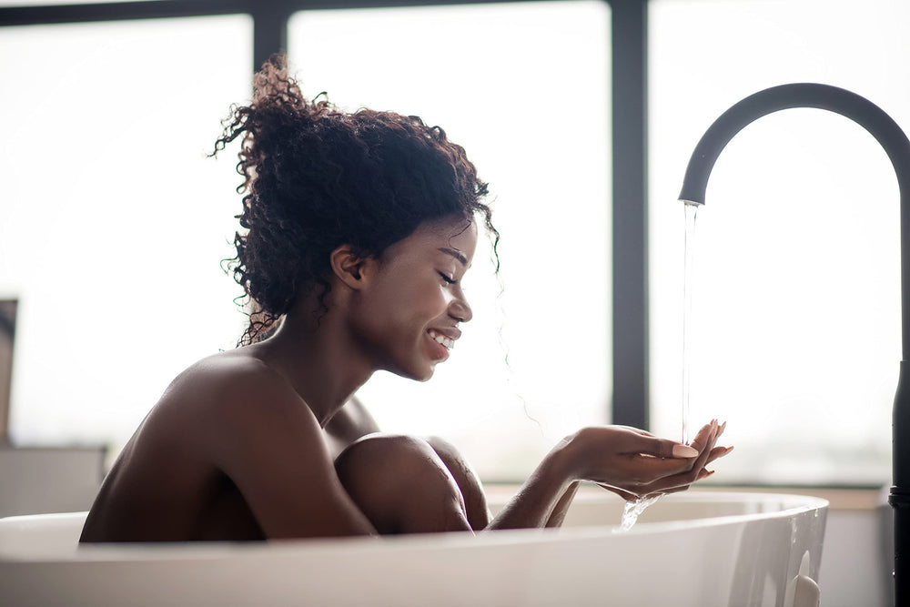 Nature's Beauty bath bomb fizzing in water with gentle bubbles