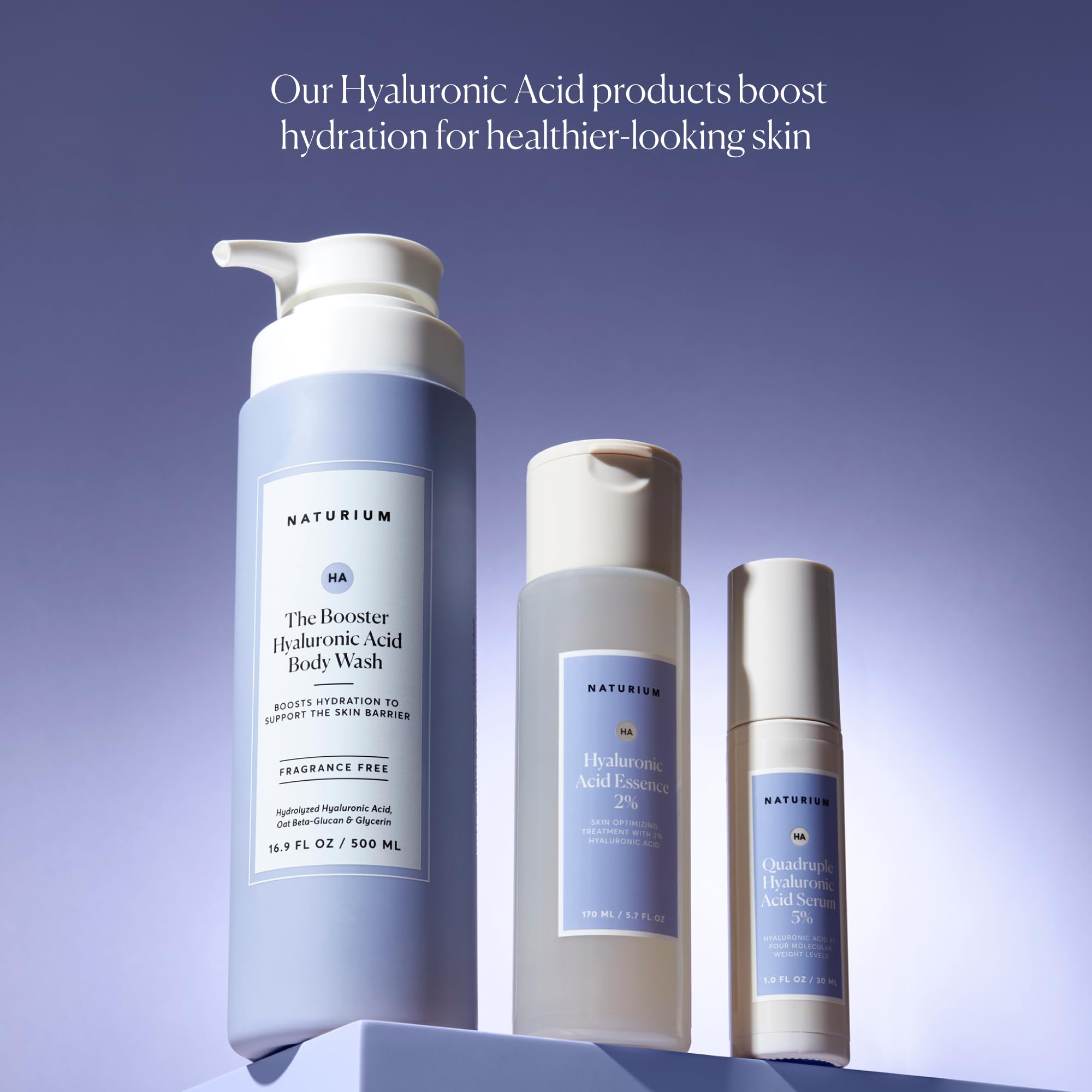 Naturium The Booster Hyaluronic Acid Body Wash glycerin droplets illustrate moisture-rich formula