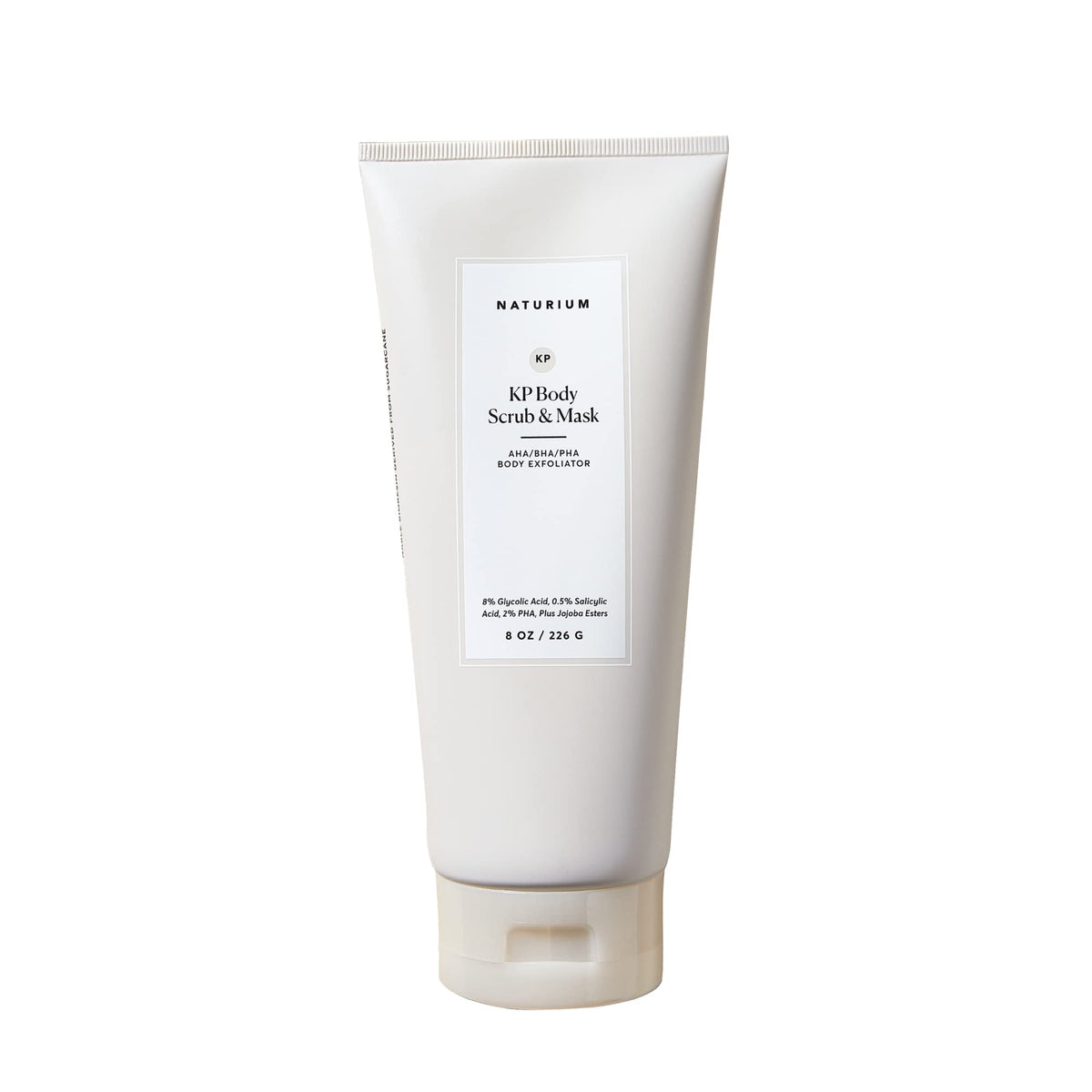 Naturium KP body scrub bottle close-up for in-shower exfoliation and smoothing