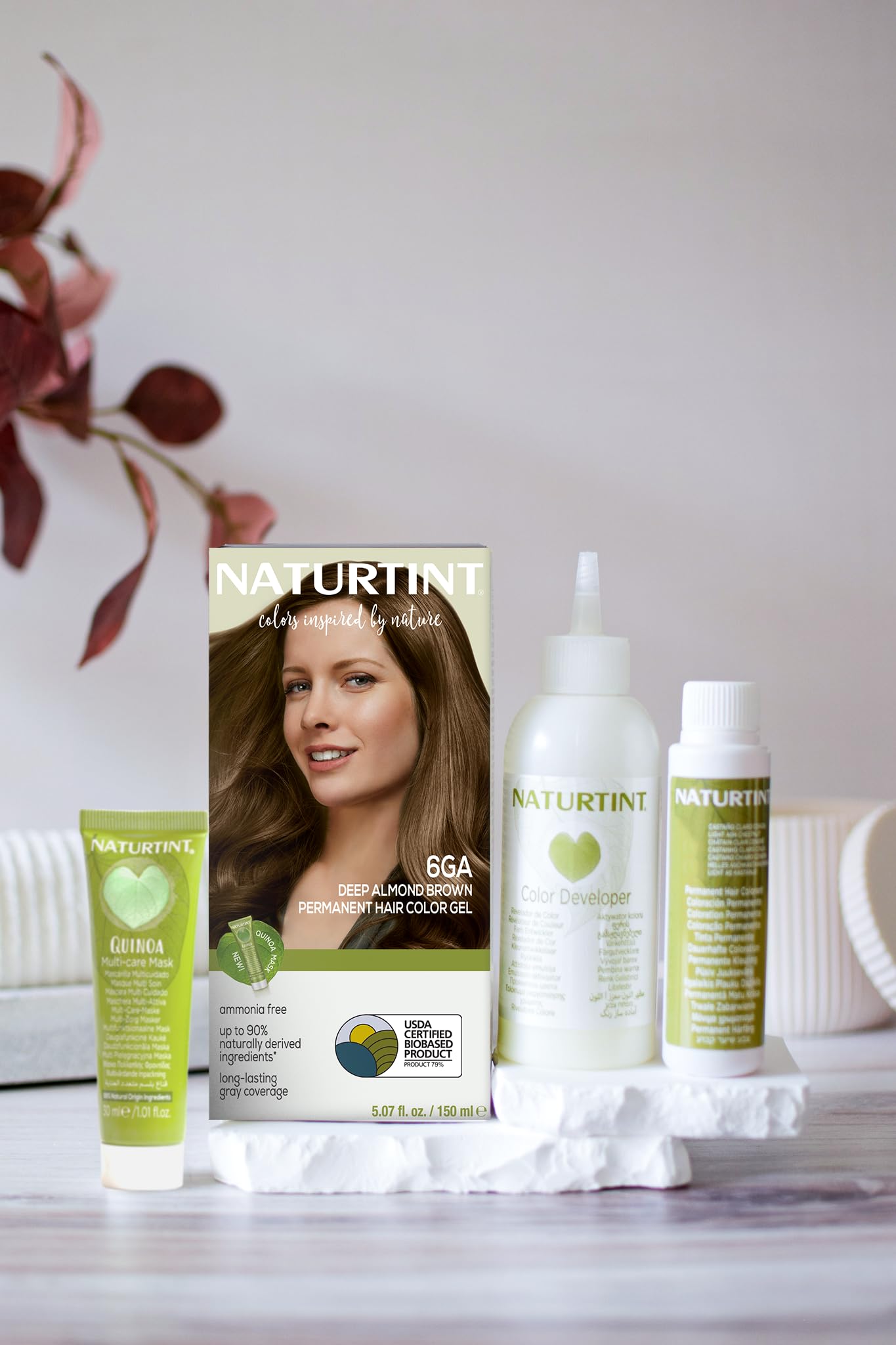 Naturtint 6GA color swatches illustrate deep almond brown shade on hair-friendly tones.