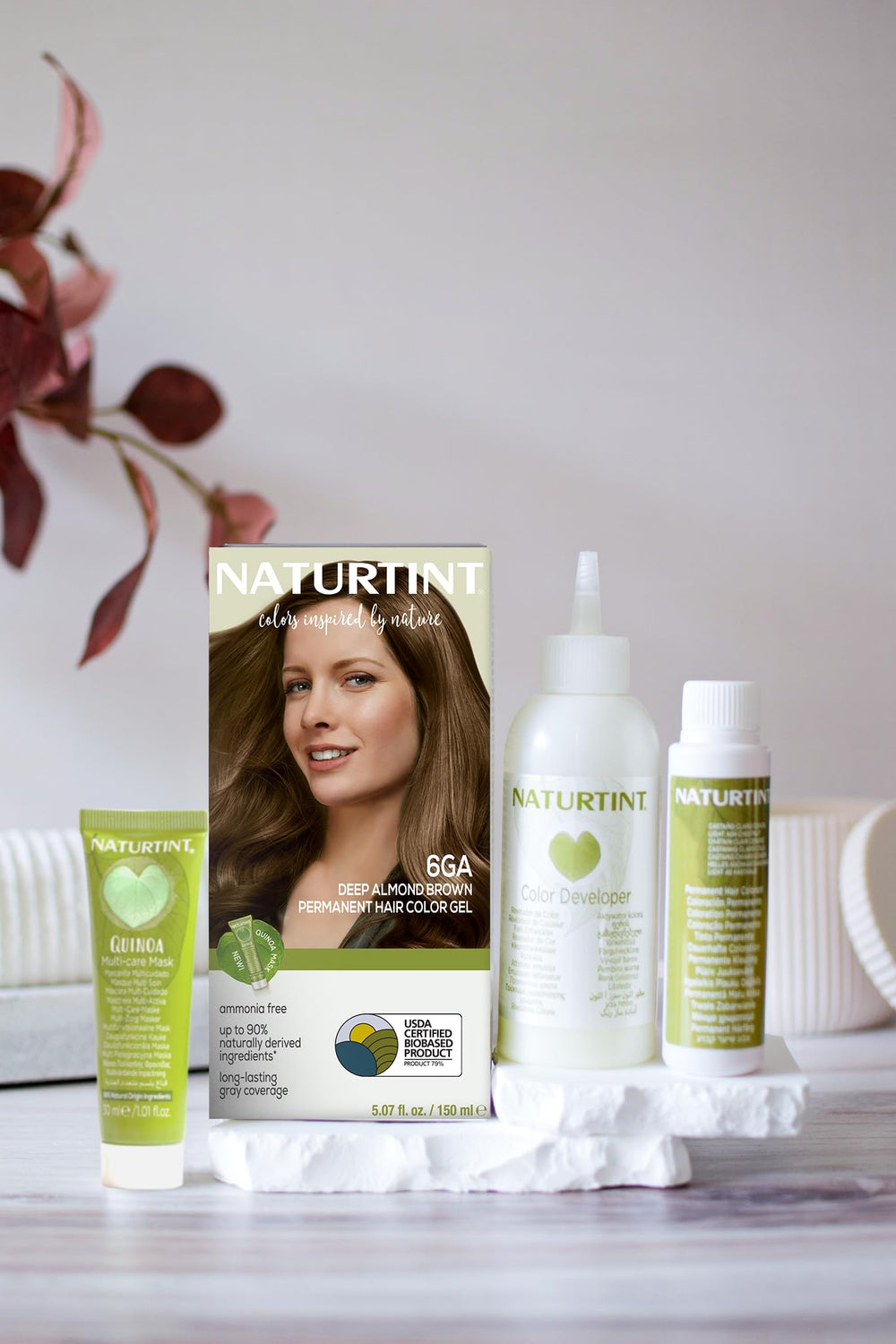 Naturtint 6GA color swatches illustrate deep almond brown shade on hair-friendly tones.