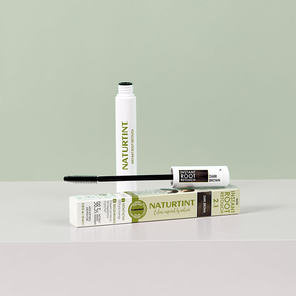Naturtint Instant Root Retouch shade range includes black and dark brown for versatile blending.