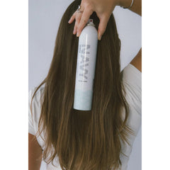 NAVY HAIR CARE Skipper spray application demonstrates root lift and quick-dry hold.