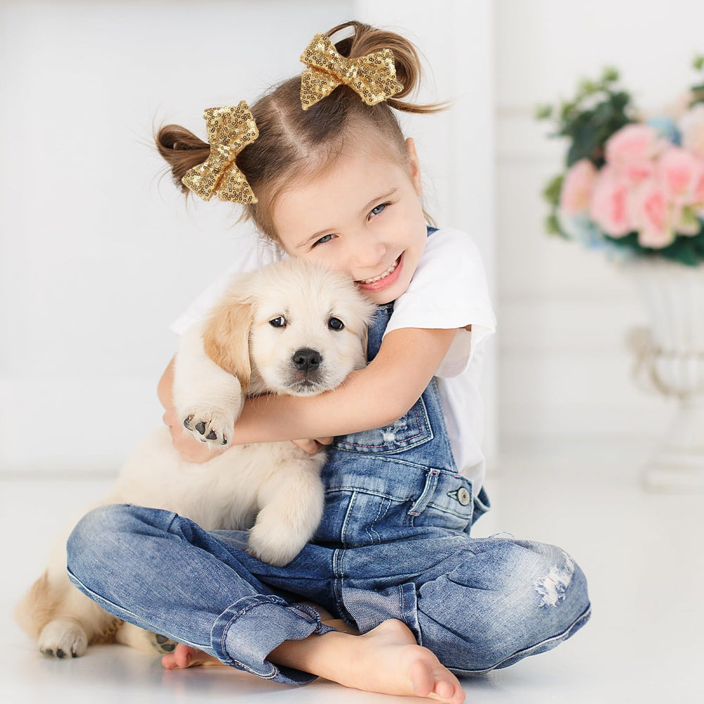 NCMAMA kid wearing gold bow evokes festive look for weddings or parties