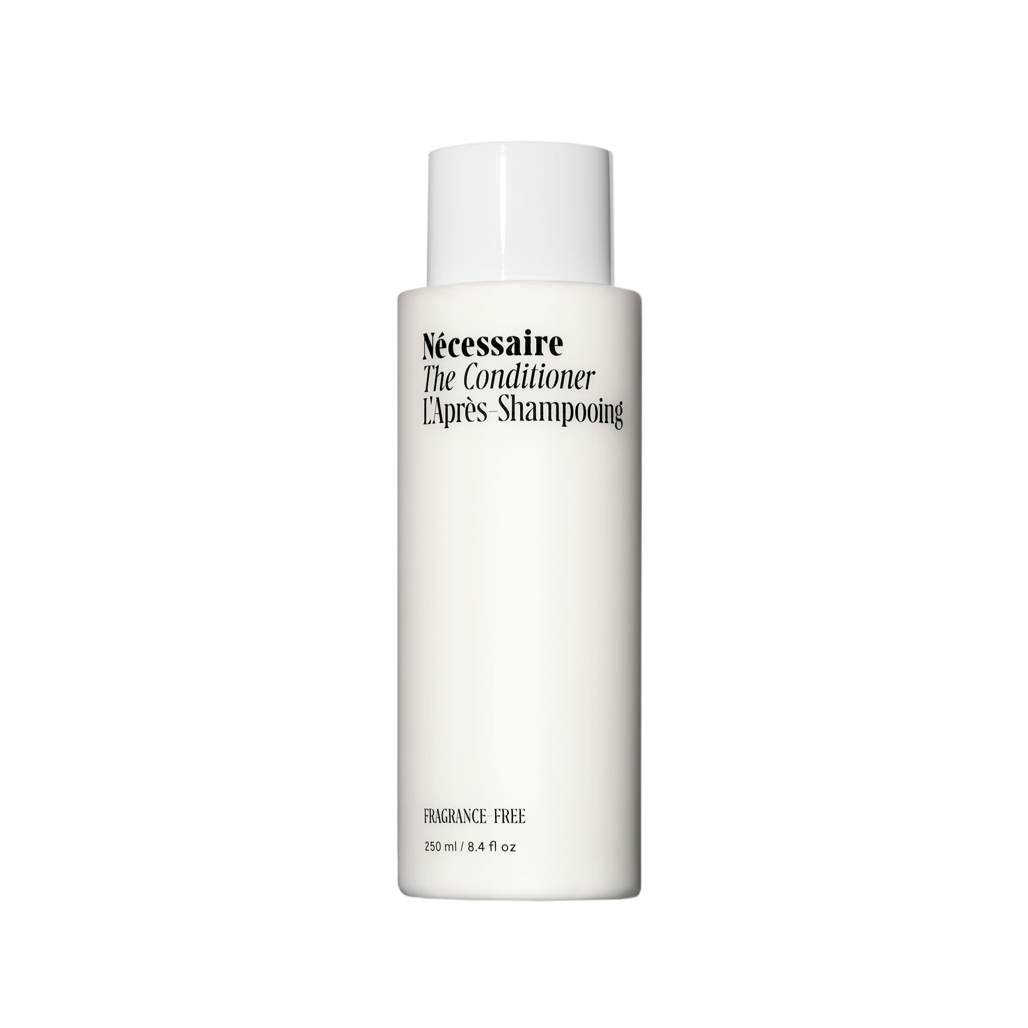 Nécessaire The Conditioner fragrance-free bottle foreground, signaling fragrance-free hydration for scalp and hair.