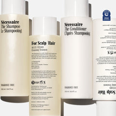 Nécessaire Hair Duo packshot — full shampoo and conditioner set with NEA Seal.
