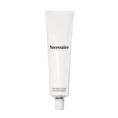 Nécessaire Hand Cream tube closeup showing fragrance-free formula for sensitive skin