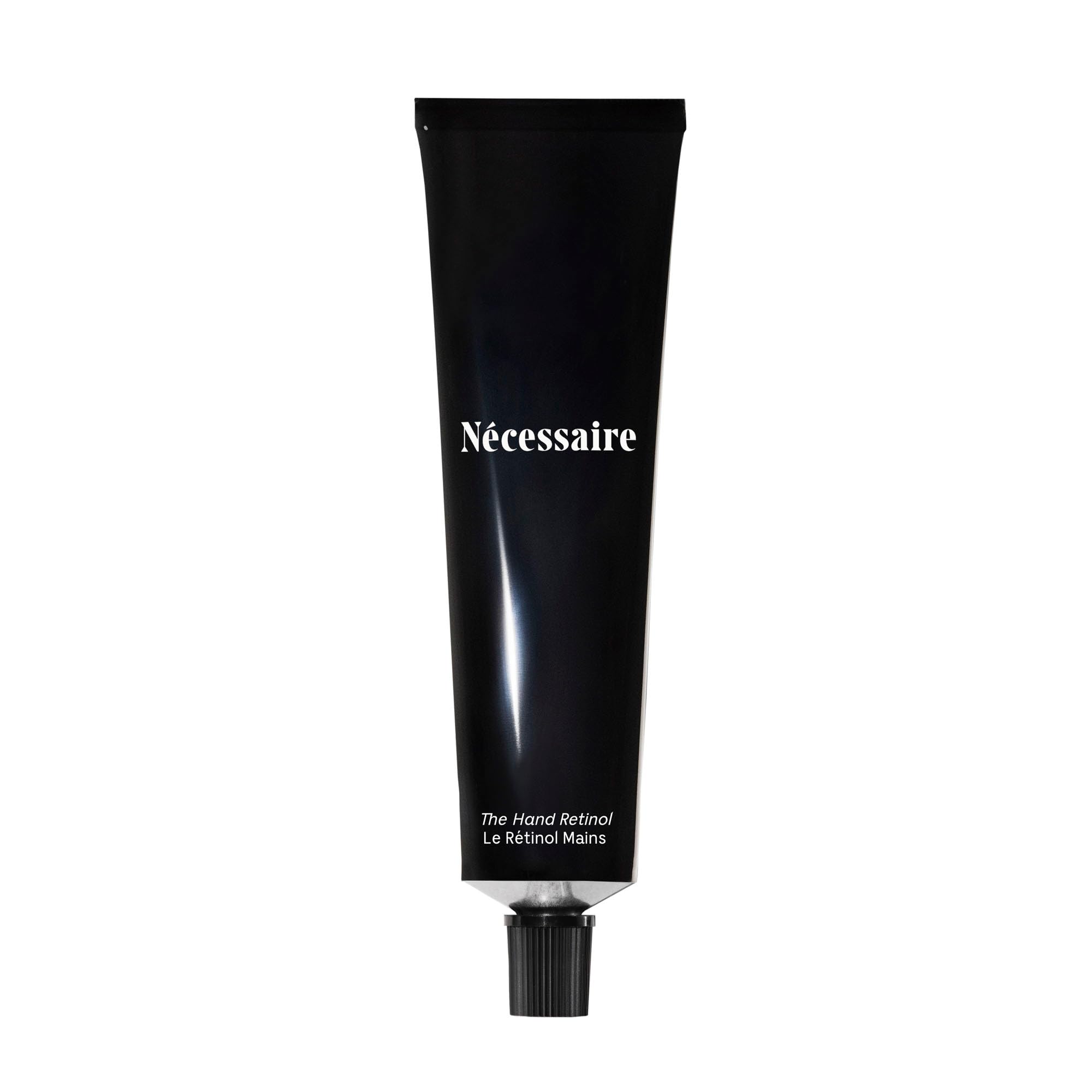 Nécessaire Hand Retinol bottle-dispense demonstrates a convenient night hand care routine.