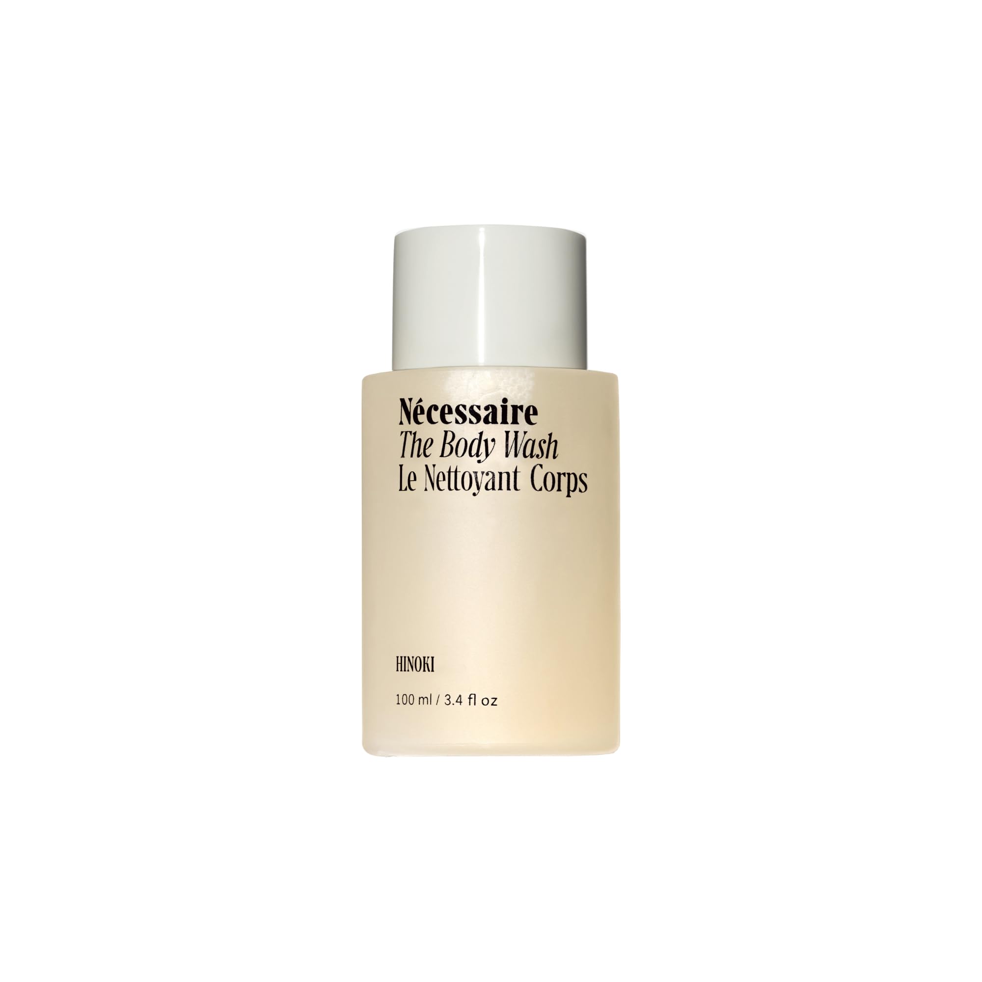 Nécessaire Hinoki body wash bottle close-up with rich lather for daily cleansing