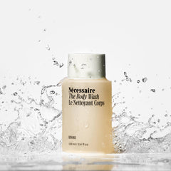 Nécessaire Hinoki signature scent notes visible on bottle shelf during shower