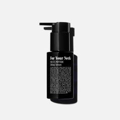 Hands applying Nécessaire neck serum with massage technique for fast absorption