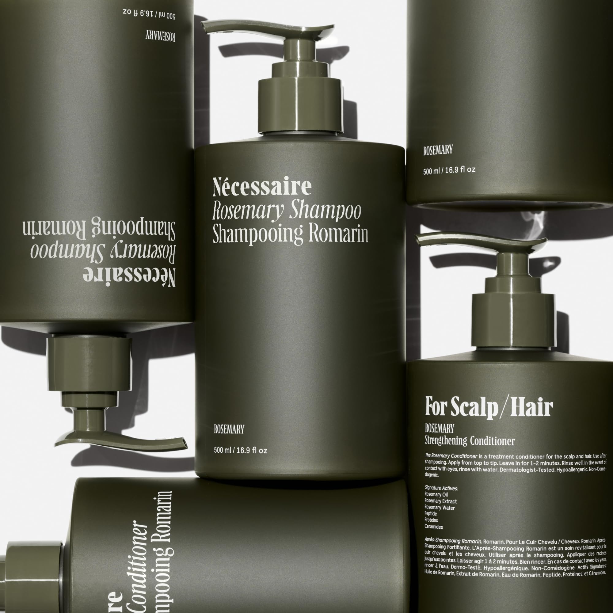Nécessaire Rosemary Hair Duo rosemary oil droplet highlighting scalp nourishment.