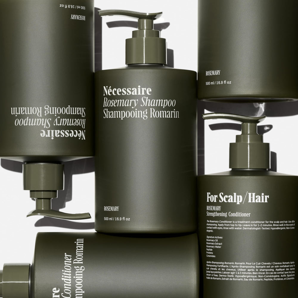 Nécessaire Rosemary Hair Duo rosemary oil droplet highlighting scalp nourishment.