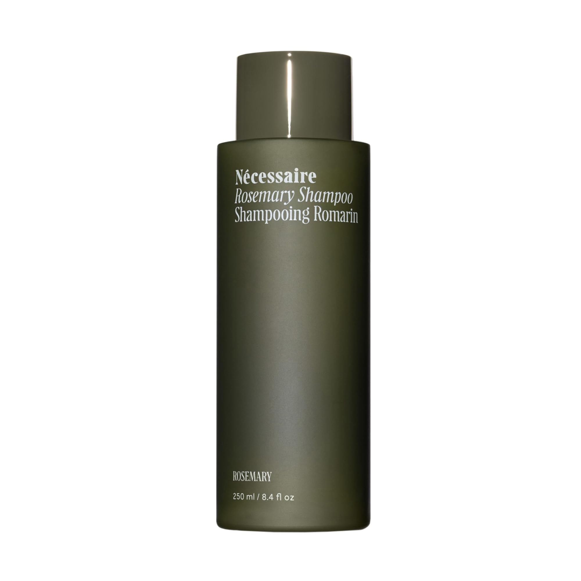 Nécessaire Rosemary Shampoo bottle pouring, depicting a gentle daily cleanse for stronger, resilient hair.